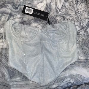 White fox boutique silver glitter corset never worn.